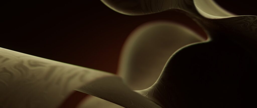 Abstract flowing golden ribbons on dark background