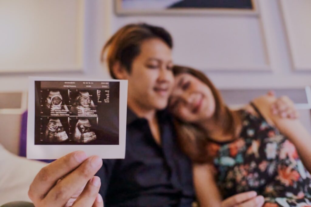 woman in black shirt holding picture