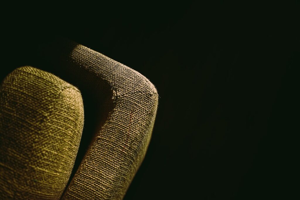 A close up of a person's hand with a black background