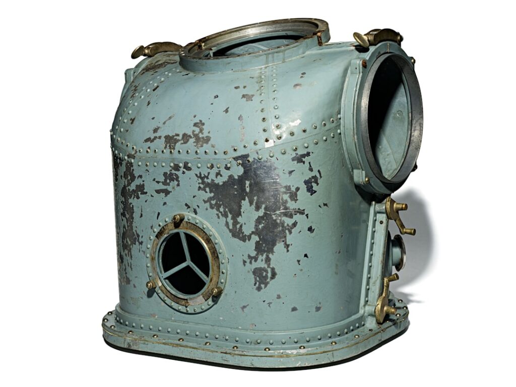 Vintage diving helmet with portholes and metal details
